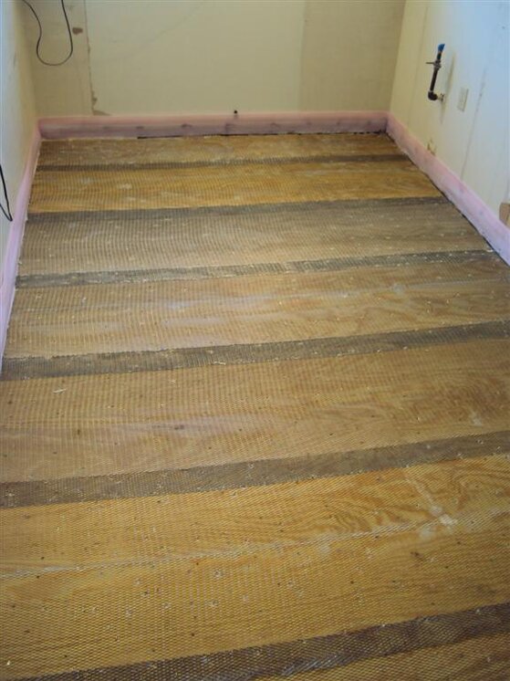 perimeter expansion joint lath fastened floor primed.JPG