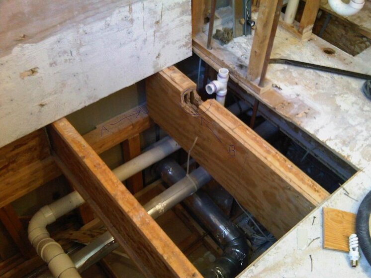A-M bathroom damaged joist under tub.jpg
