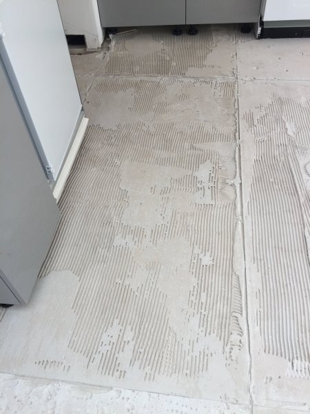 How do I remove old tile adhesive?