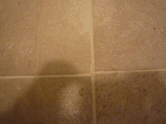 floor tile misaligned and moving.jpg