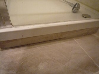 under shower grout missing.jpg