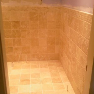 Photo 0097 200x200 unfilled travertine with mosaic border.