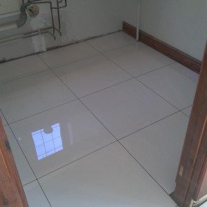 Kitchen Floor Tiling in Ashford Kent.
600 x 600 White Polished Porcelain.