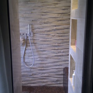 Bisazza and natural stone wetroom.