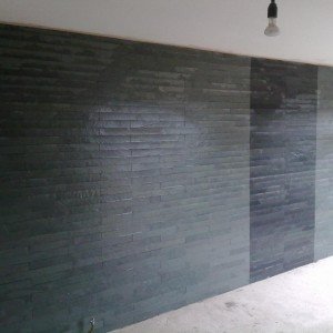 feature wall in artists lounge...600x10 green/grey and black brazillian slate, ungrouted.