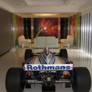 Damon Hill's championship winning car from the 1996 season. White polished porcelanosa 60x60 porcelain tiles with epoxy grout. 190m2 showroom and garage.