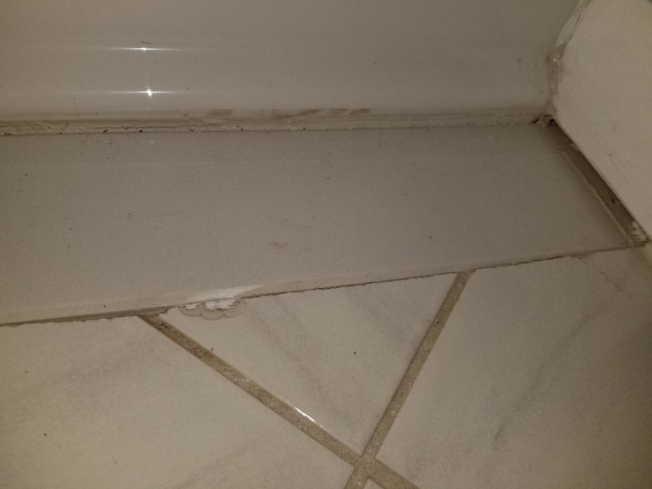 bathroom flooring gap.jpg
